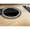 Close-up of an acoustic guitar's soundhole and strings