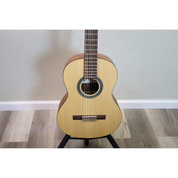 Protégé by Córdoba C1M 3/4 classical guitar, front view of natural spruce top and fretboard