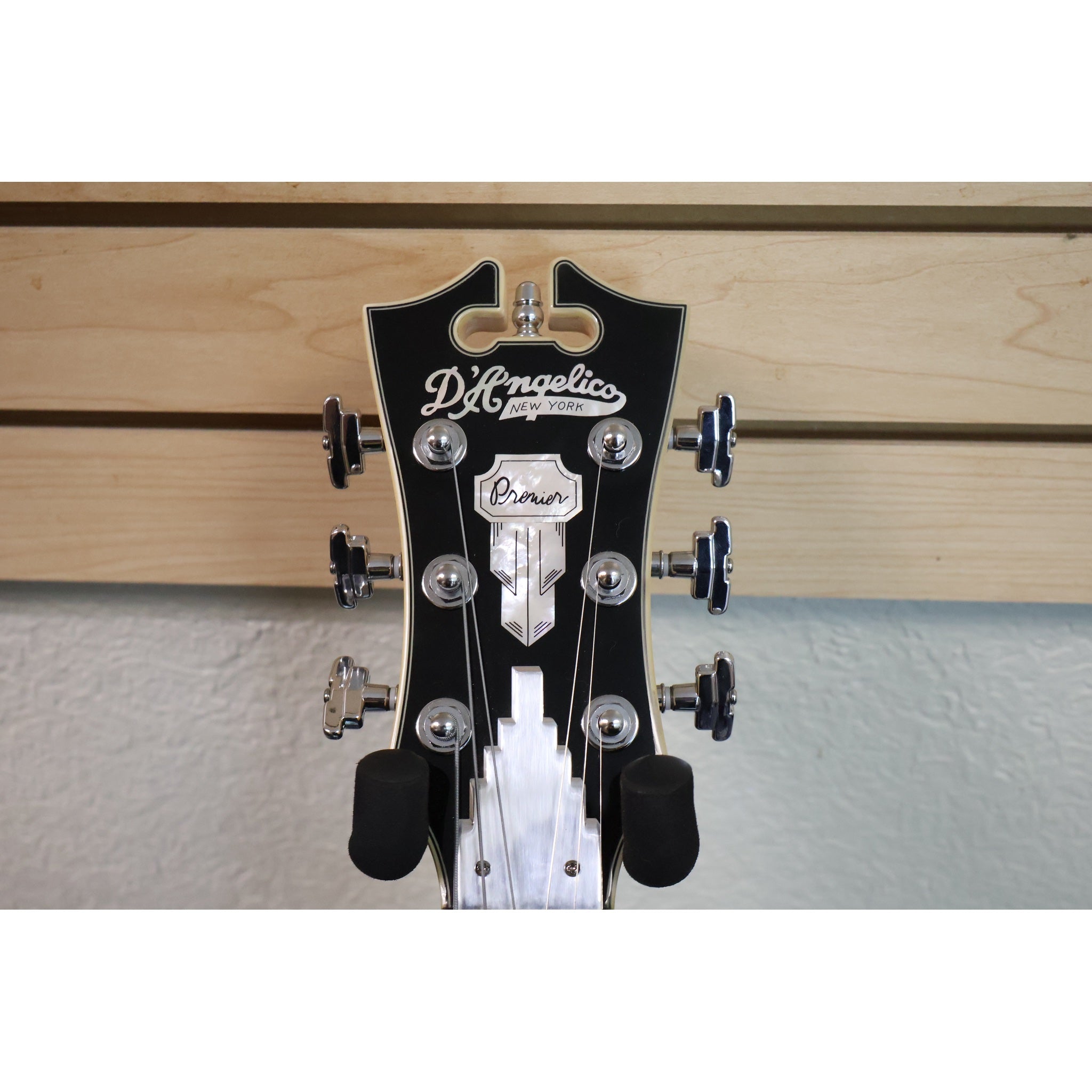 D'Angelico Premier Bedford SH headstock front with mother-of-pearl logo and Premier shield inlay
