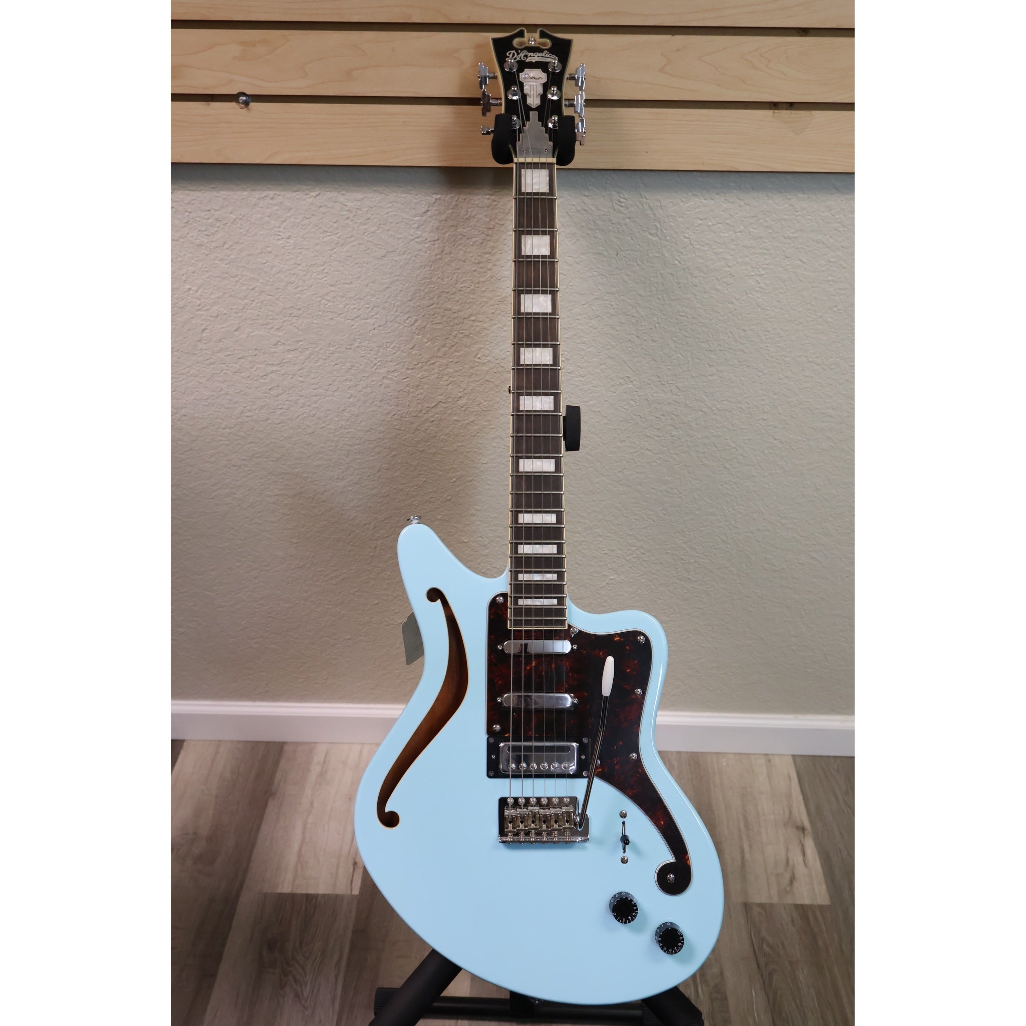 D'Angelico Premier Bedford SH Sky Blue semi-hollow electric guitar, full front on stand
