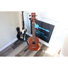 Córdoba Mini II Bass MH-E mahogany travel bass on a stand at El Cajon Guitars & Music
