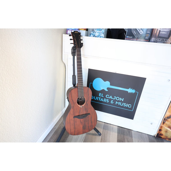 Lâg Sauvage PE Parlor Acoustic-Electric Guitar in a stand at the front of El Cajon Guitars &. Music..
