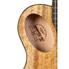 Close-up of a wooden ukulele with Kala Revelator Night Owl Mango Tenor Acoustic-Electric Ukulele a brand logo engraved on the soundhole.