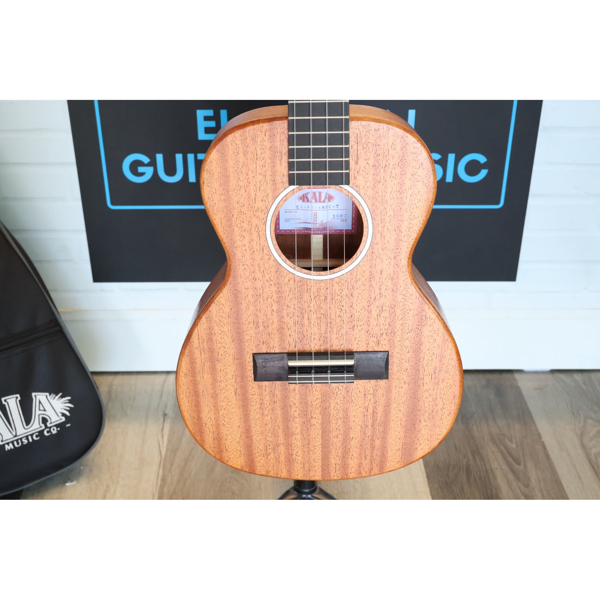 Close-up of a Kala KA-WF-AMHG-T All Solid Mahogany Waterfall Tenor Ukulele at ECGMusic.