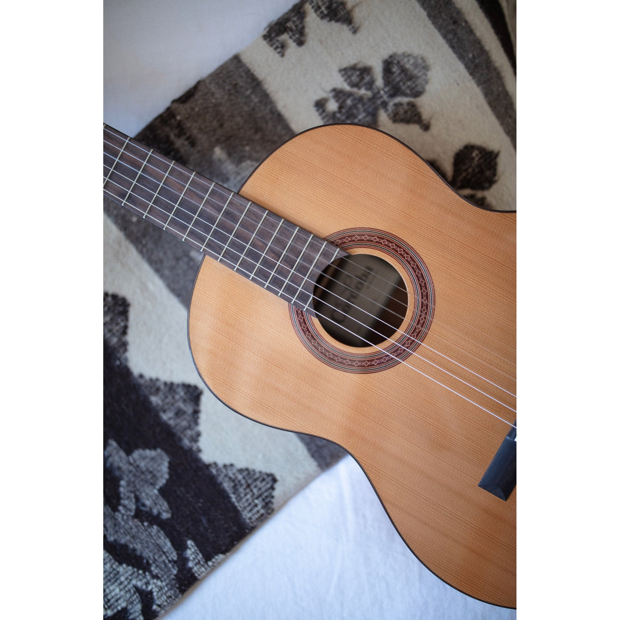 Córdoba C5 CD Acoustic guitar on a patterned surface
