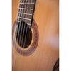 Córdoba C5 CD Close-up of a classical guitar's soundhole and wooden body.