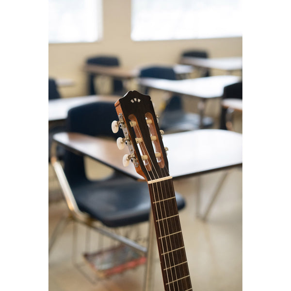 Córdoba C3M Guitar headstock in a classroom setting