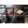 Guitar on a couch with amplifiers and speakers in the background