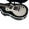 Electric guitar in a black case on a white background