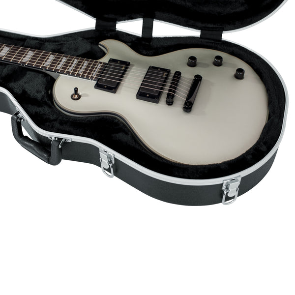 Electric guitar in a black case on a white background