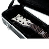 Guitar in a black case with 'squier' branding
