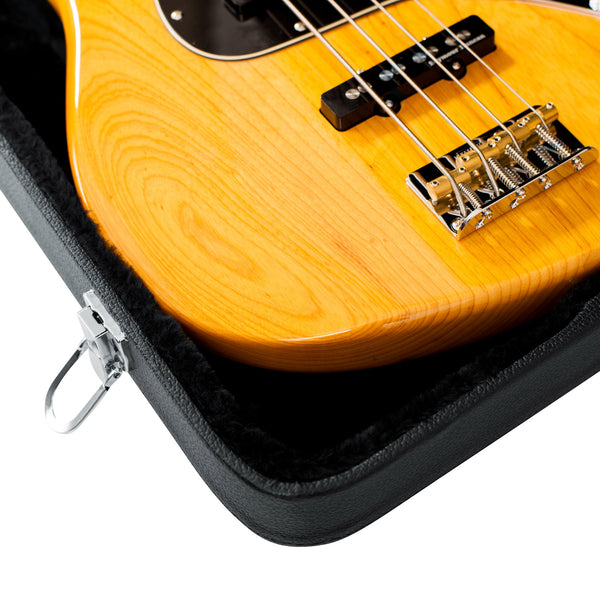GWE-BASS Close-up of a yellow electric bass guitar in a black case on a white background