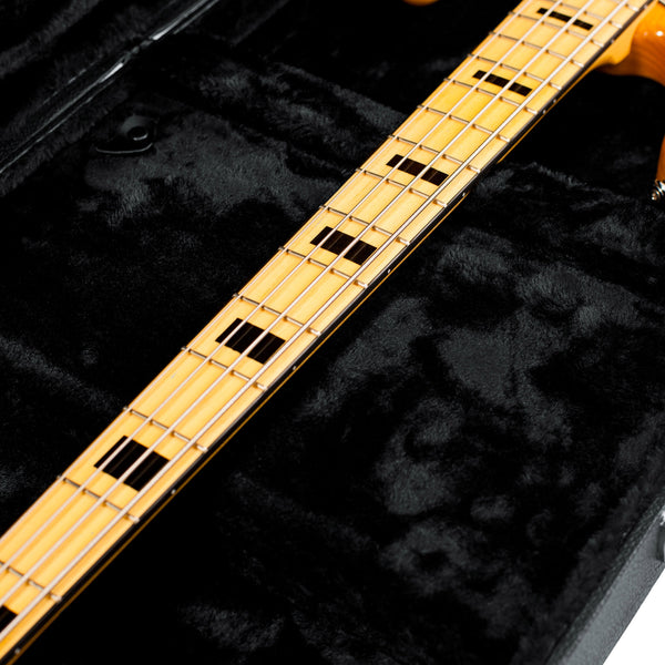 GWE-BASS Close-up of a guitar neck on a black background