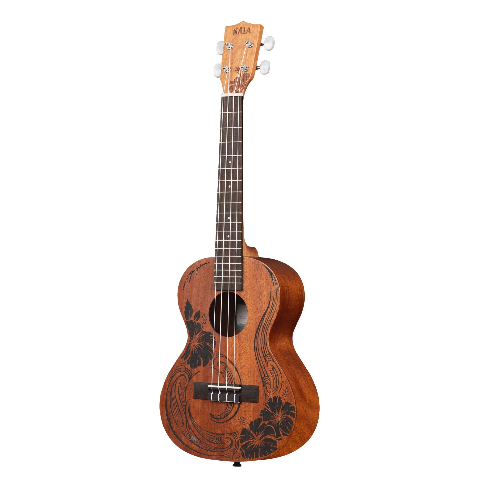 A Kala Unity Mahogany Tenor Ukulele w/ Bag - KA-UNITY-T_W/BAG with a warm brown finish, featuring black floral and scrollwork hand-painted designs on the front, a dark fretboard, and white tuning keys on the headstock. The brand name 'AKIA' is clearly visible at the top of the headstock.