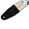 Guitar strap with black leather end and patterned fabric on a white background