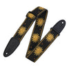 Black guitar strap with gold sun designs on a white background