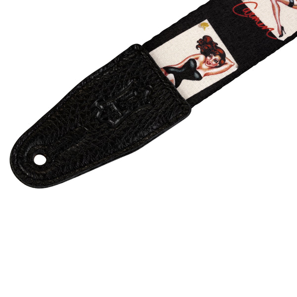 Black guitar strap with vintage-style design on a white background
