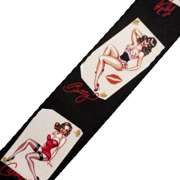 Guitar strap with vintage-style illustrations of women in swimsuits and 'Betty' text on a black background.