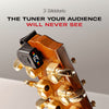 A close-up of a guitar headstock with gold tuning pegs and a black D'Addario clip-on tuner attached, set against a light gray background with promotional text reading 'THE TUNER YOUR AUDIENCE WILL NEVER SEE' and the D'Addario logo.