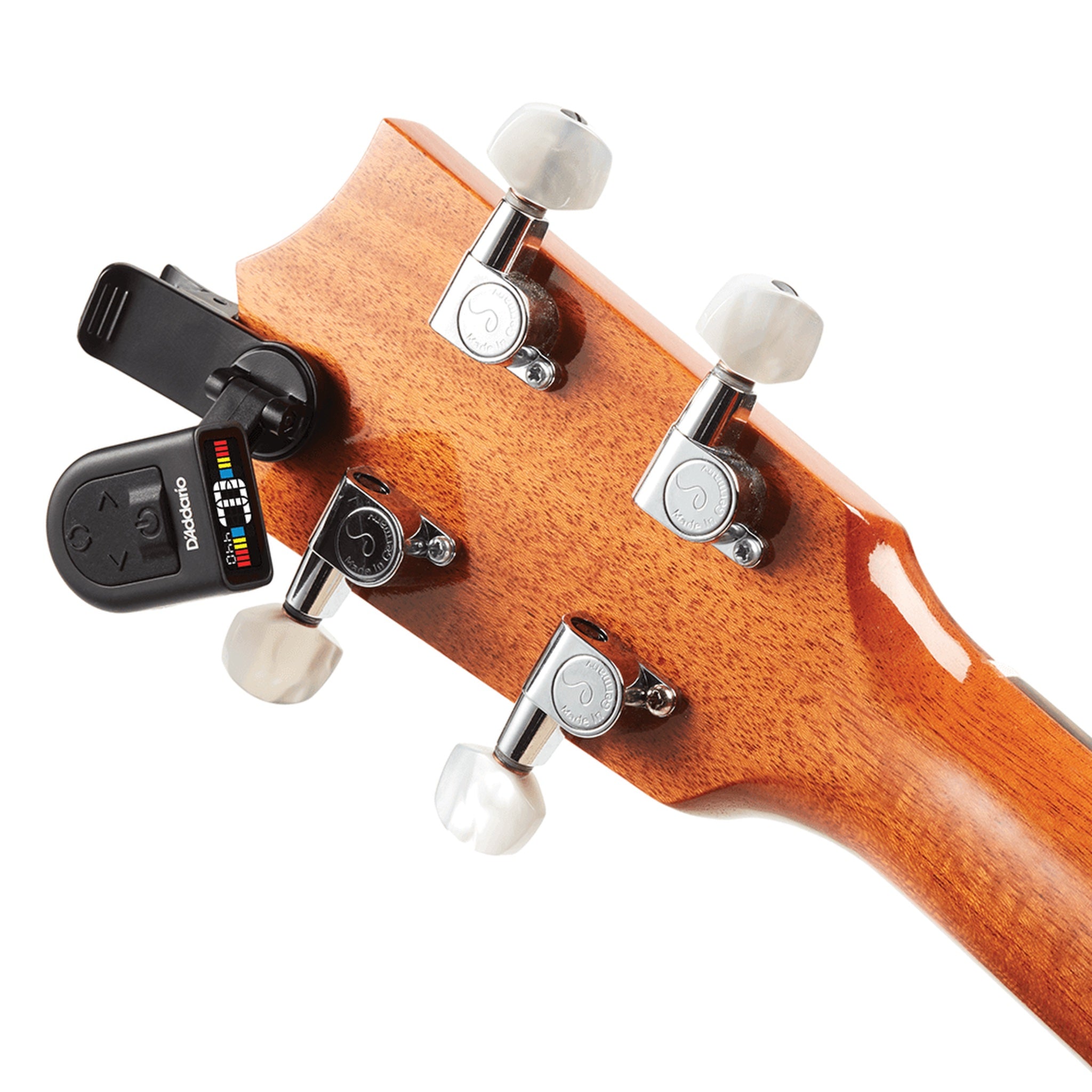 Guitar headstock with a tuner on a white background