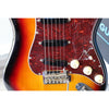 Close-up of a Fender electric guitar with a sunburst finish.