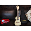 Amahi ukulele with a case on a dark surface