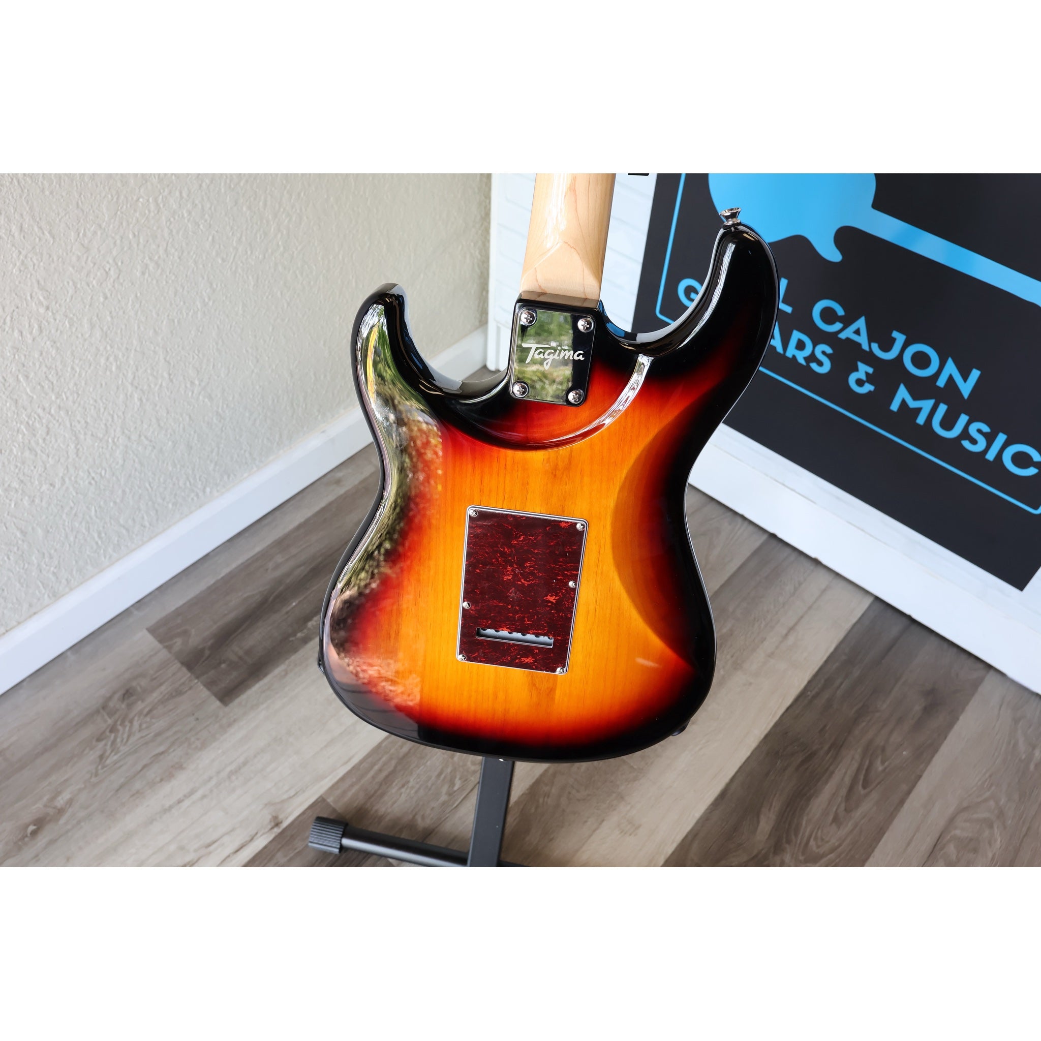Electric guitar on a stand with a blurred background