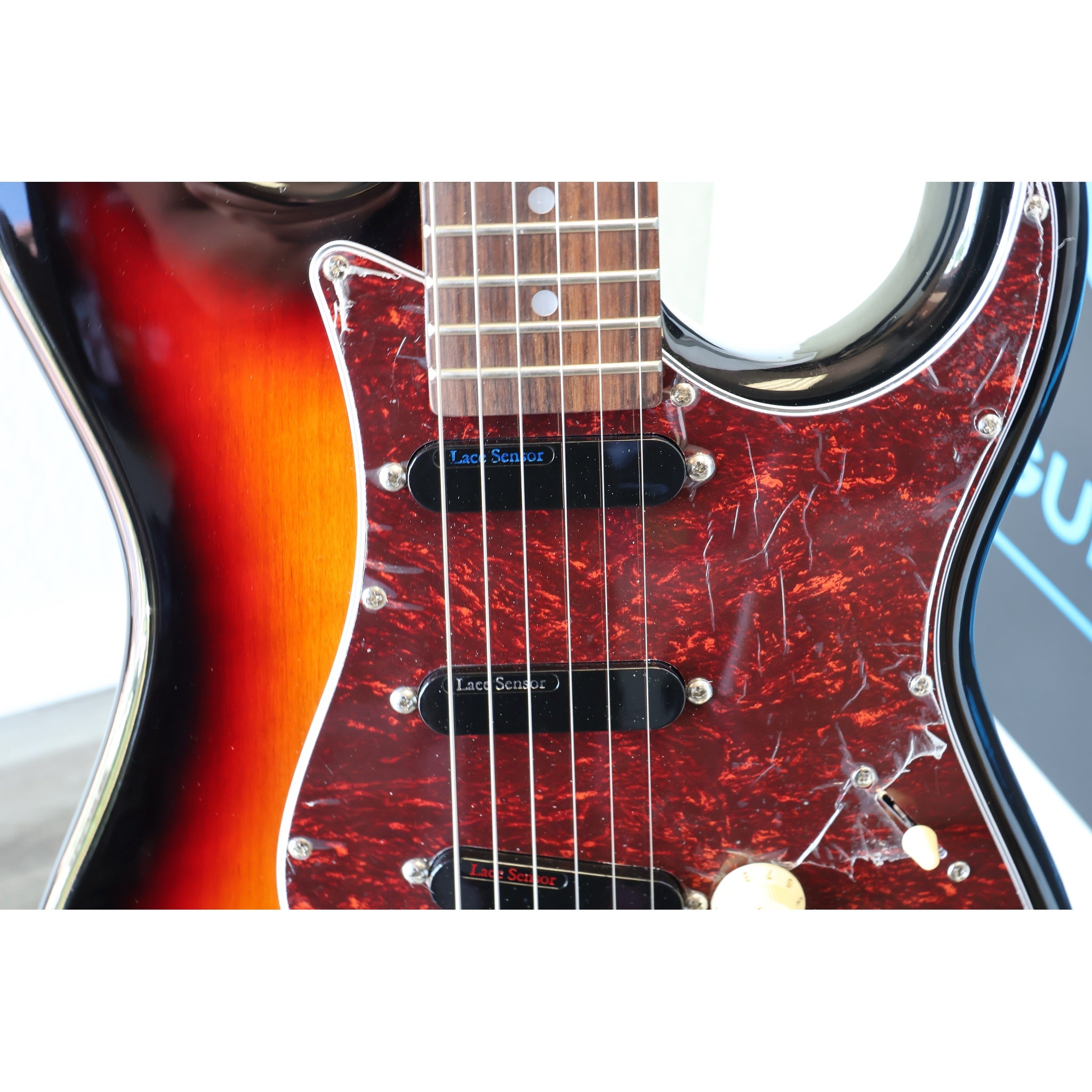 Close-up of a Tagima electric guitar with Lace Sensor pickups