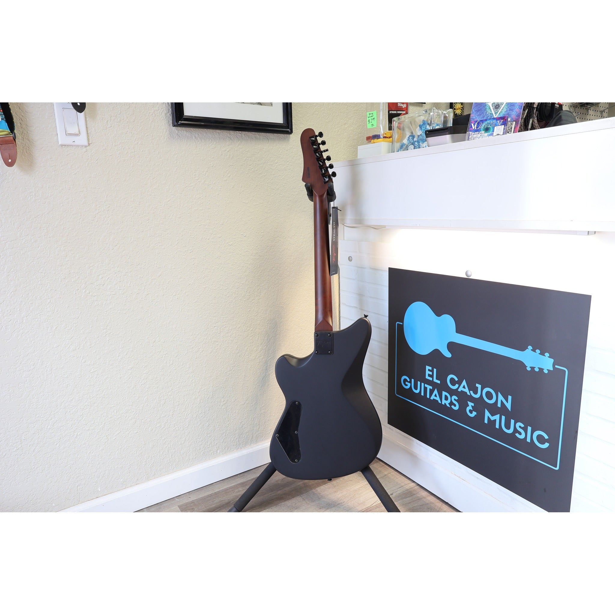 Tagima Rocker Cosmos Stealth guitar back view showing roasted maple neck and satin black finish