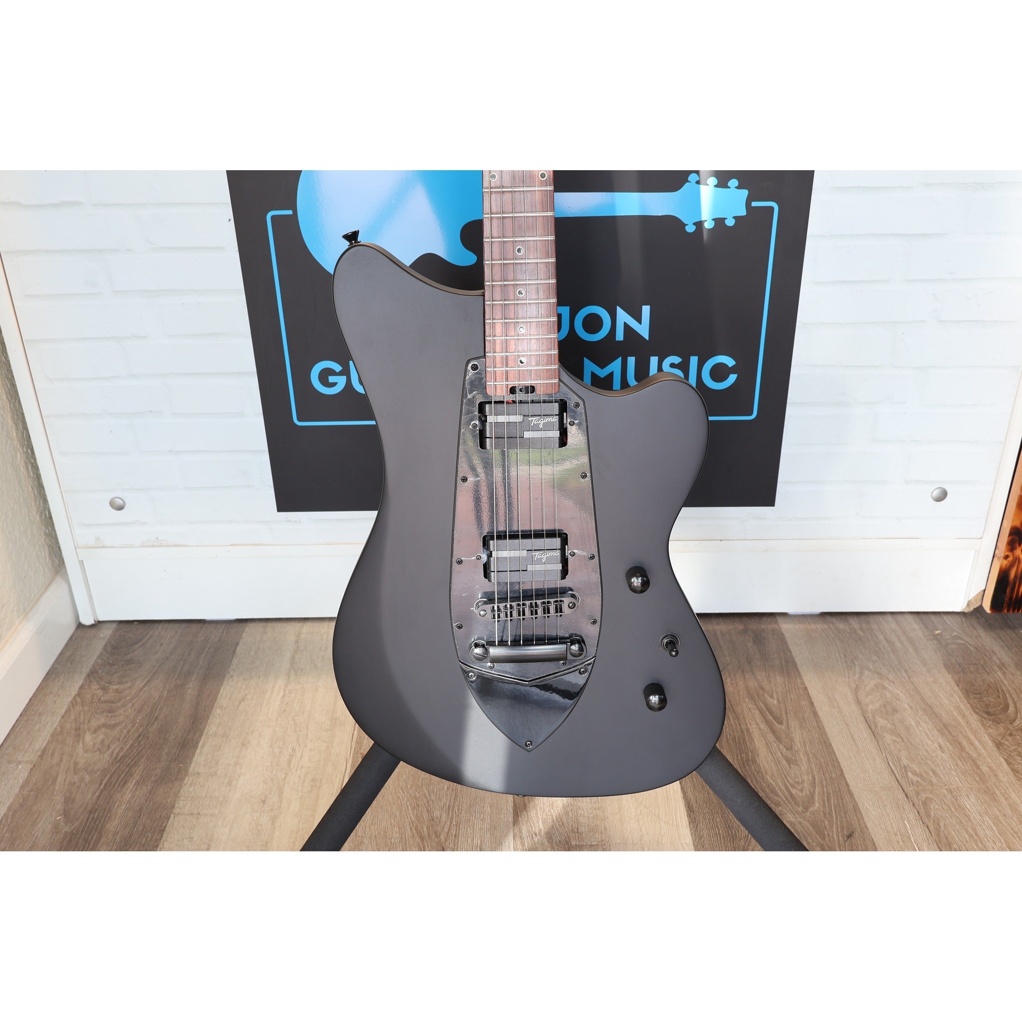 Tagima logo and headstock face on the Rocker Cosmos Stealth electric guitar