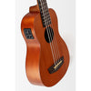 A close-up of a Kala Nomad Acoustic-Electric U•BASS® - UBASS-NOMAD-FS with four strings, a sound hole, and a black pickup component on the side, photographed against a plain light background.