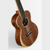 Kala West Coast Woods Walnut Tenor Ukulele, three-quarter view showing figured walnut top