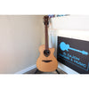 This Lâg HyVibe 10 HV10ACE, Serial Number 2604LT07360 full guitar front in stand at El Cajon Guitars & Music.