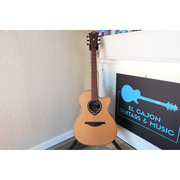 This Lâg HyVibe 10 HV10ACE, Serial Number 2604LT07360 full guitar front in stand at El Cajon Guitars & Music.