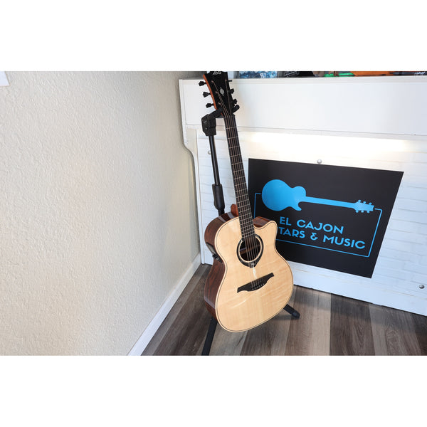 Lag Smart Guitar Hyvibe 30 Auditorium Cutaway Gloss at ECG Music - front full acoustic guitar in stand at ECGMusic