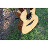 Lag Smart Guitar Hyvibe 30 Auditorium Cutaway Gloss at ECG Music on stand in grass.