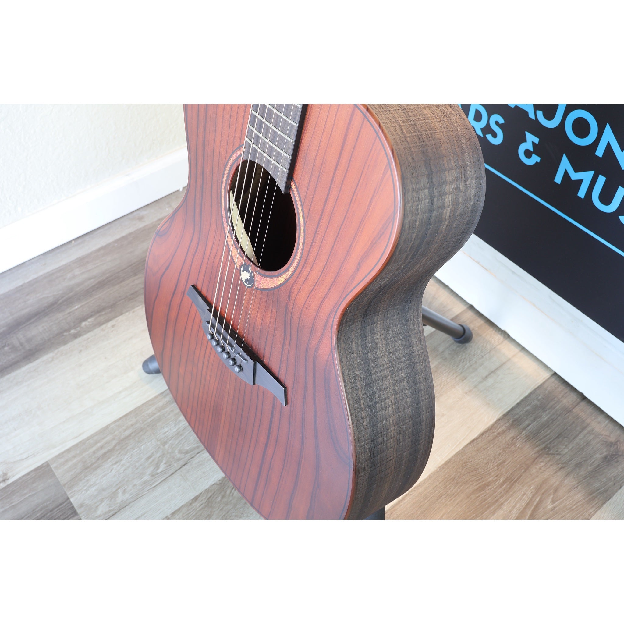This Lâg Sauvage-A Auditorium Acoustic Guitar with Serial 2511LT20951, side and top body view showing wood grain.