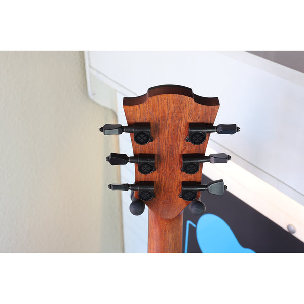 Close-up of the headstock of Headstock of this guitar a Lâg Sauvage-A Auditorium Acoustic Guitar with Serial 2511LT20951.