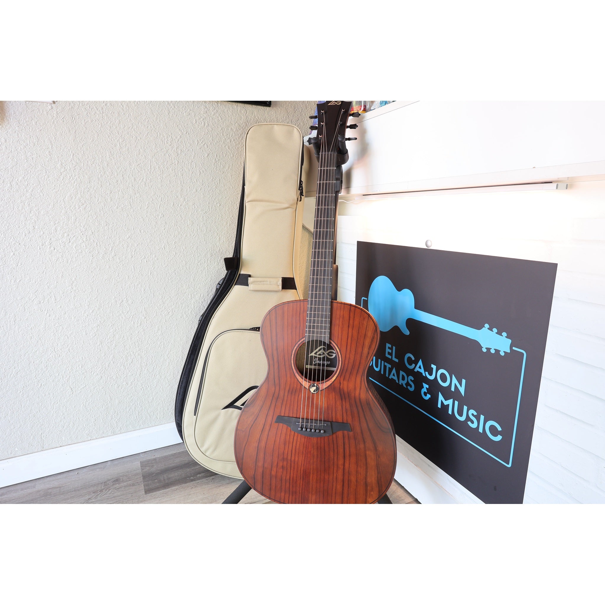 This Lâg Sauvage-A Auditorium Acoustic Guitar with Serial 2511LT20951 comes with soft shell case.