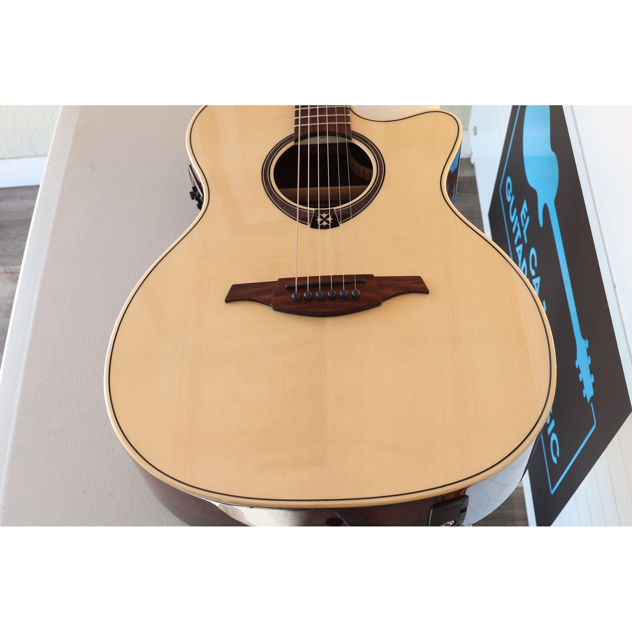 Lâg T218ACE Tramontane 218 Auditorium Acoustic-Electric Guitar – Natural Gloss - Serial Number 2511LT19929 - natural light at ECGMusic.com top angle grain.