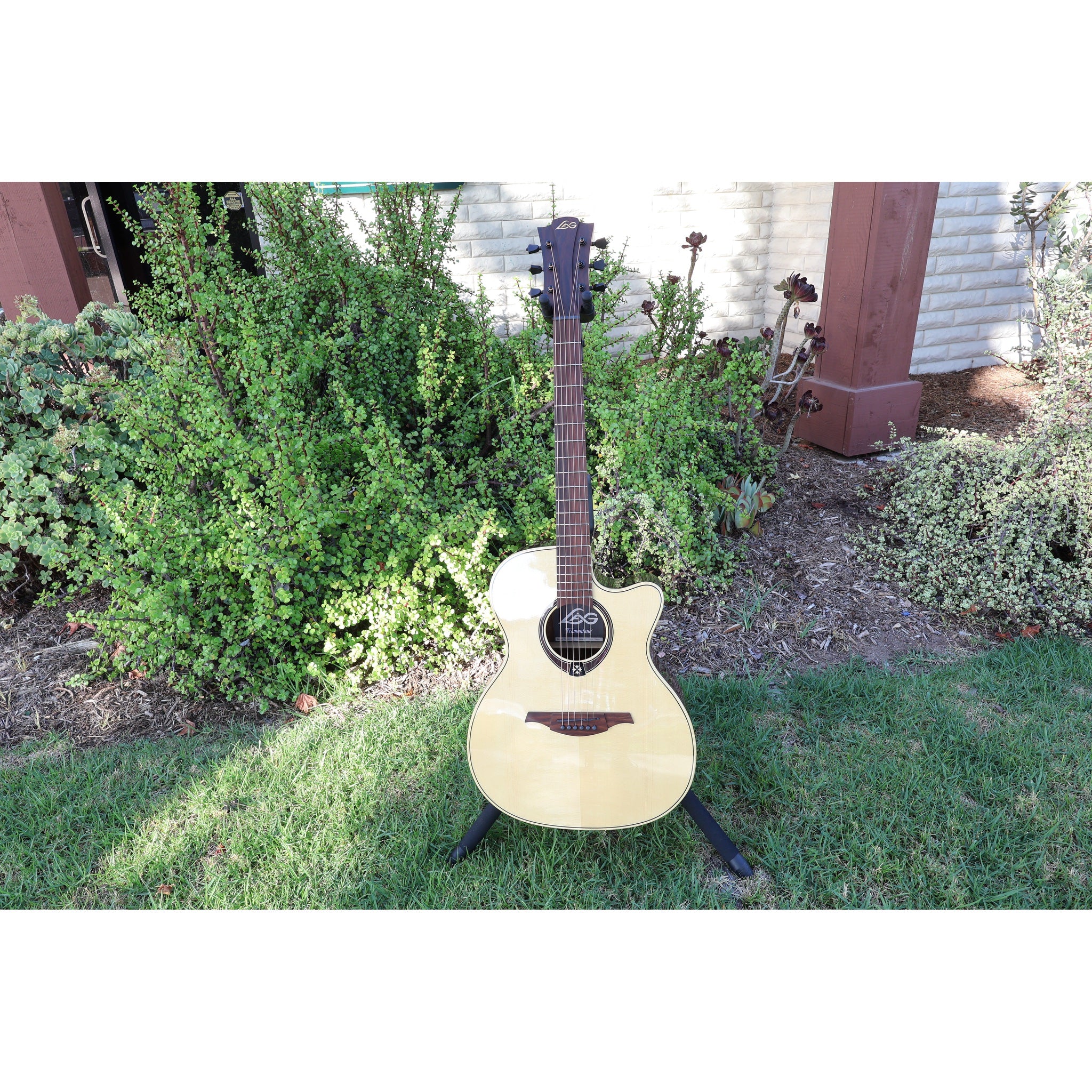 Lâg T218ACE Tramontane 218 Auditorium Acoustic-Electric Guitar – Natural Gloss - Serial Number 2511LT19929 - natural light at ECGMusic.com outside