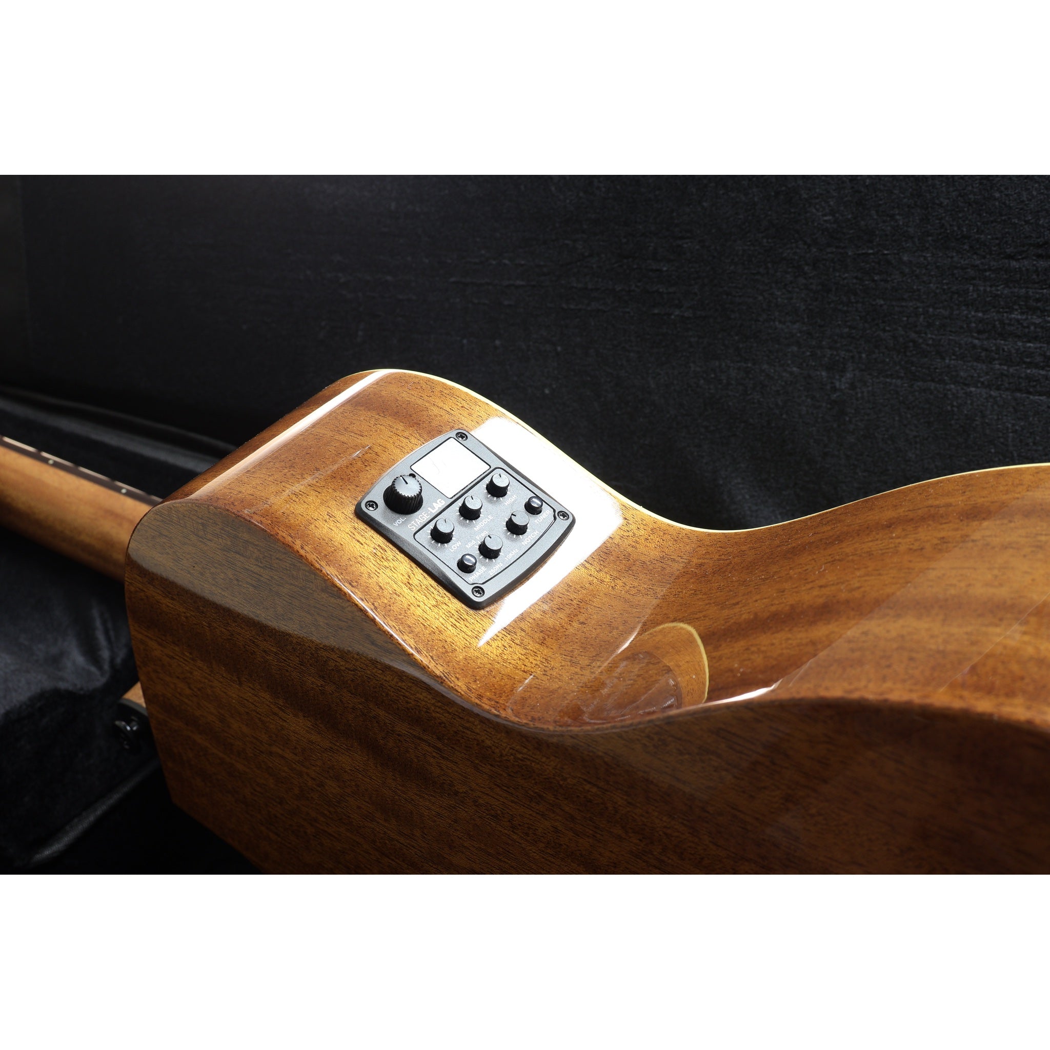 Close-up of a Lâg Tramontane T88ACE Auditorium Cutaway Acoustic-Electric Guitar w/ guitar body with a glossy brown finish and a black control panel featuring a small display and buttons, set against a dark background.