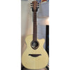 Lâg Tramontane T88ACE Auditorium Cutaway Acoustic-Electric Guitar with a natural wood finish and a dark neck, photographed against an indoor wall background.