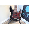 Front view at slightly downward angle of Tagima T-635 Classic Black Electric Guitar with Lace Sensor Red/Silver/Blue Pickups