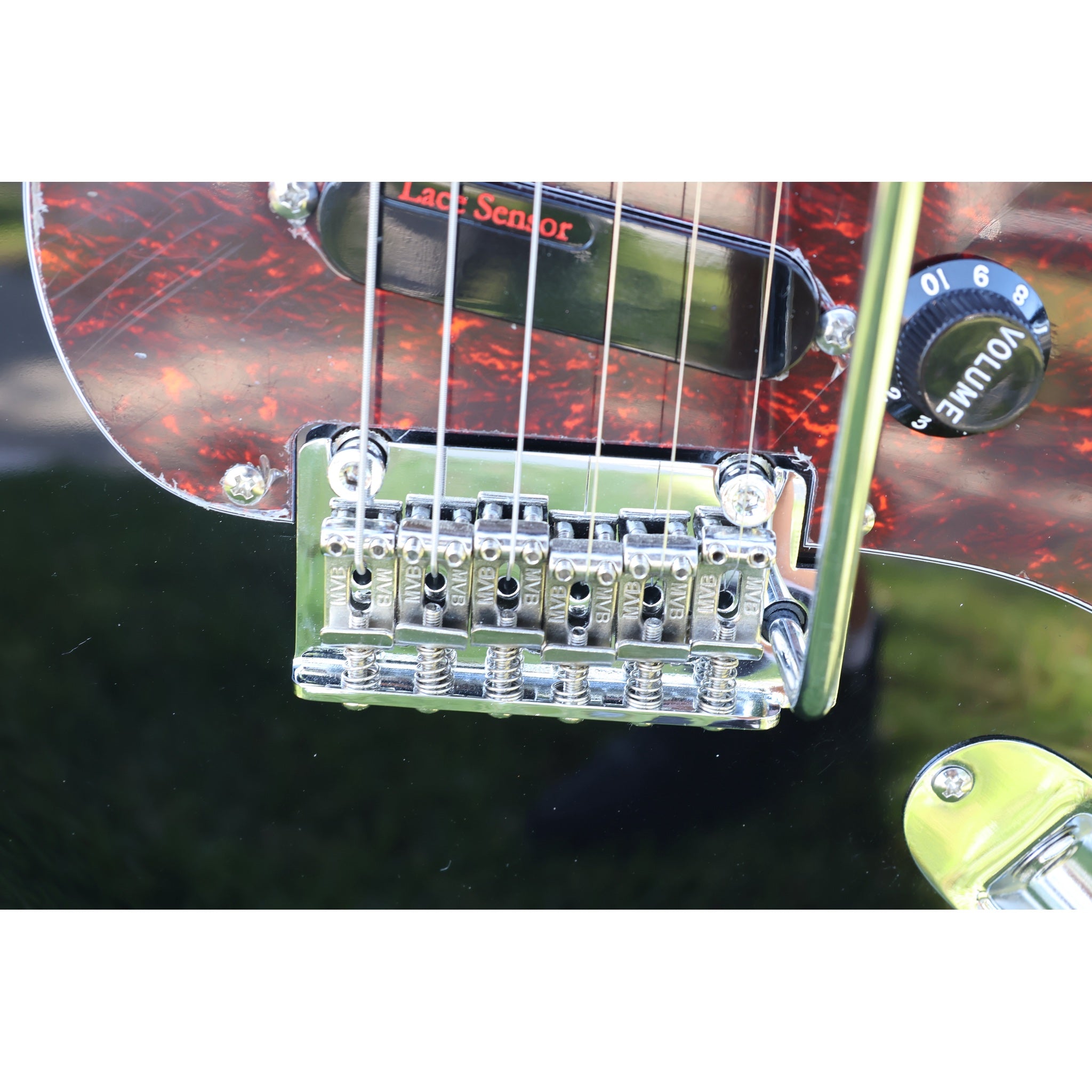 Closeup of the great bridge and tremolo arm on the Tagima T-635 Classic Black Electric Guitar with Lace Sensor Red/Silver/Blue Pickups.